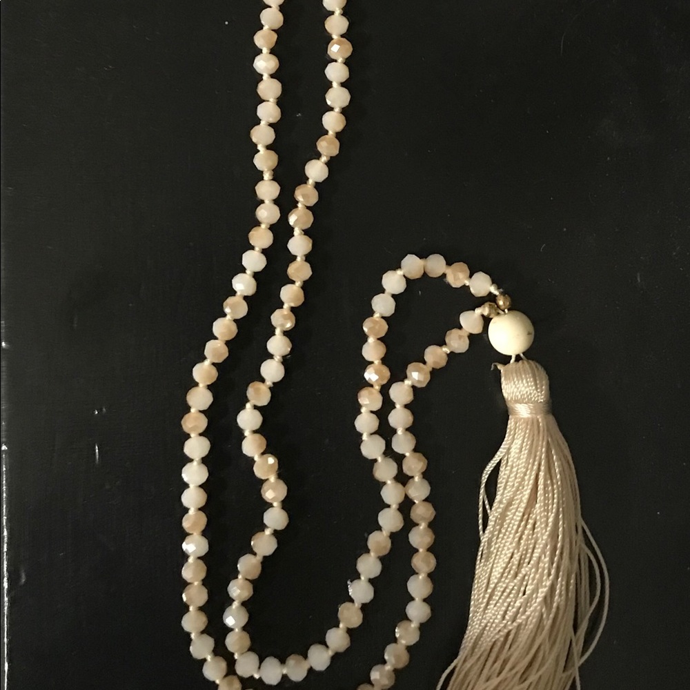Ivory beaded necklace with earrings.